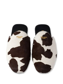 Prada cow-print slip-on mules