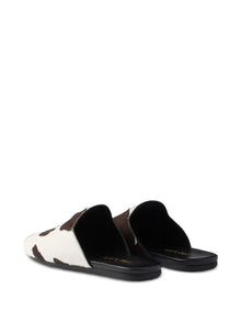 Prada cow-print slip-on mules
