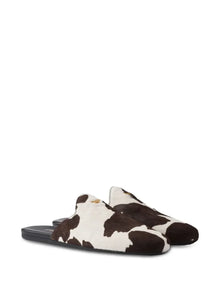 Prada cow-print slip-on mules
